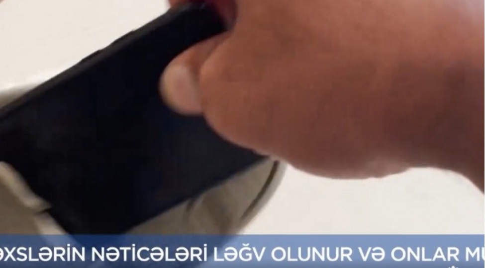 dim-imtahan-ishtirakchisi-mobil-telefonunu-ayaqqabisinin-altinda-gizletmeye-cehd-gosterib